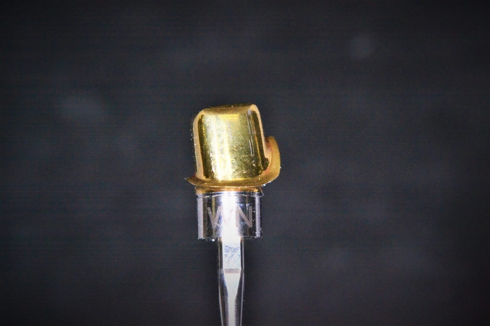 Closeup of a golden tooth for Digital Implant